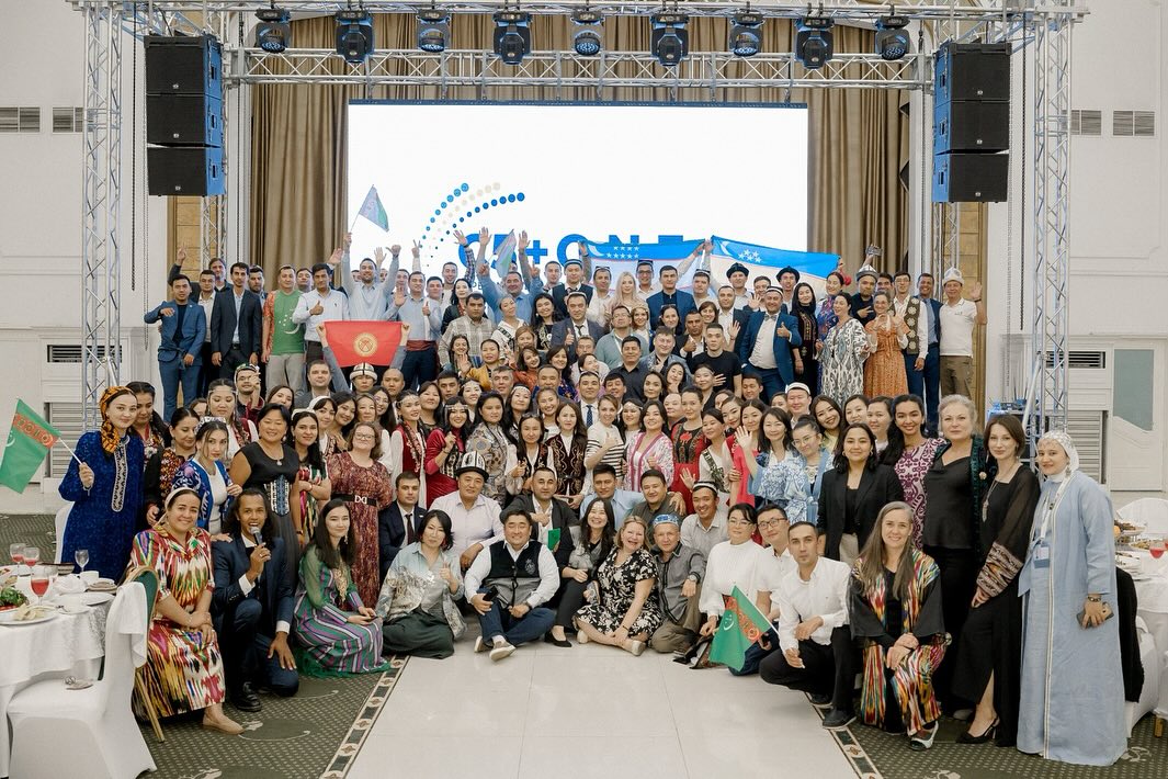 C5 + O.N.E. Group Photo with Flags _ AC Kazakhstan
