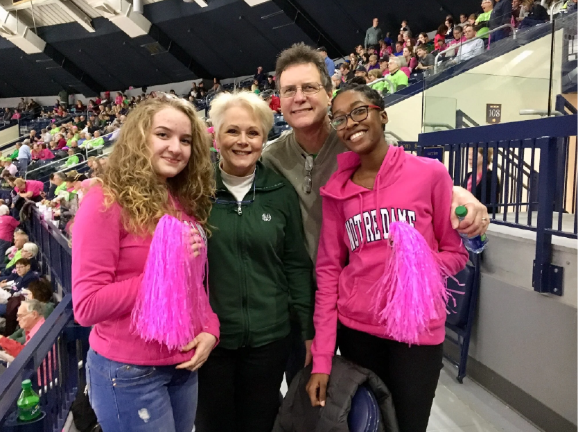 Host family with student at sporting event